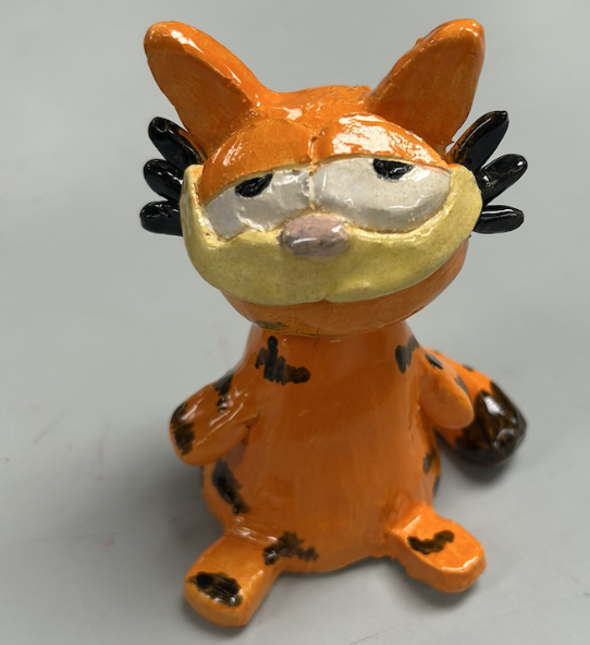An orange cat object with a shiny finish.