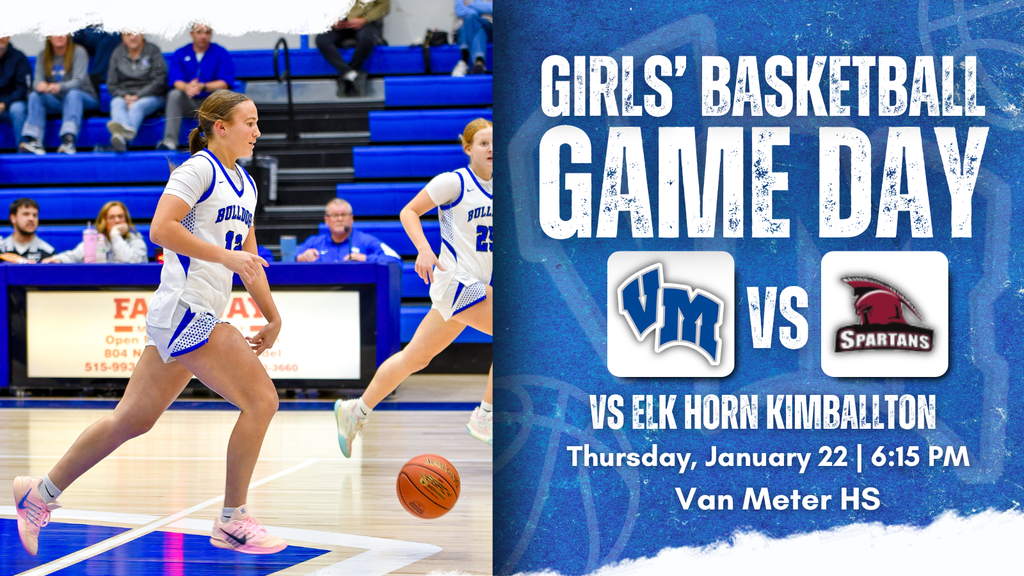 Van Meter girls basketball player in white and blue uniform dribbling the ball on a gym court during a game. Girls' Basketball Game day vs Elk Horn Kimballton on Thursday, January 22 at 6:15 PM.