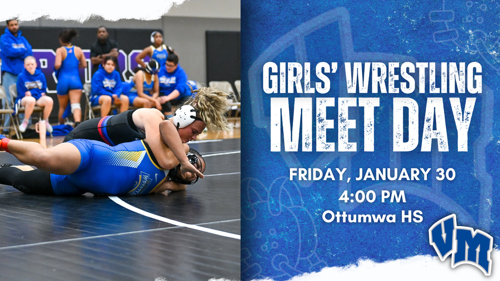 Two female wrestlers competing intensely on a mat during a high school wrestling match with teammates watching in the background. Girls' Wrestling Meet Day on Friday, January 30 at 4:00 PM at Ottumwa HS.