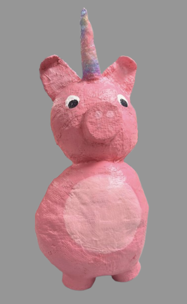Pink pig-shaped figure with a pastel rainbow unicorn horn and a round light pink belly on a gray background.