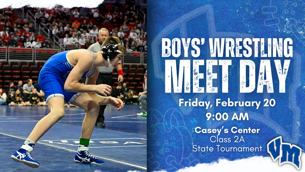 Two boys wrestling on a mat during a match with a referee watching closely in a crowded arena.