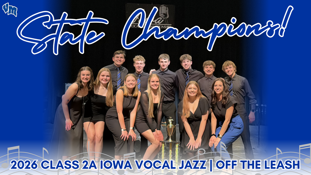 Group of young vocal jazz performers posing with a state championship trophy, dressed in formal black attire against a blue backdrop.