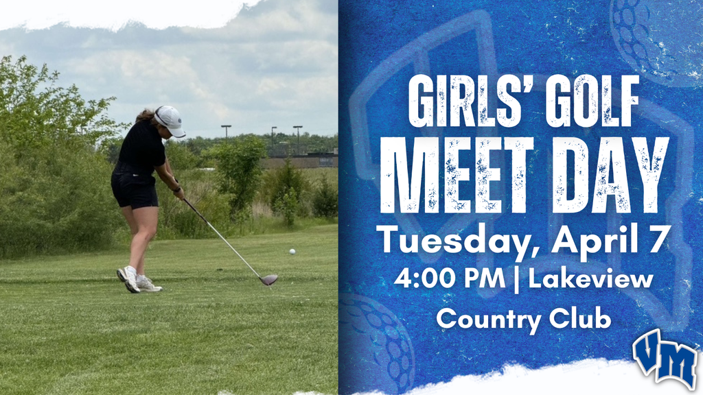 Female golfer in mid-swing on a sunny golf course preparing to hit the ball.