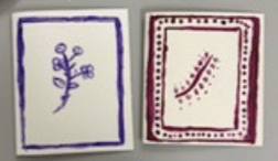 Two small bordered cards, one blue and one red, each displaying a simple abstract line symbol.