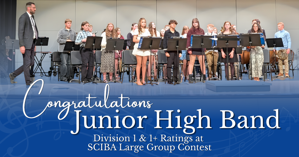 Junior high band members standing on stage after receiving Division 1 and 1+ ratings at SCIBA Large Group Contest.
