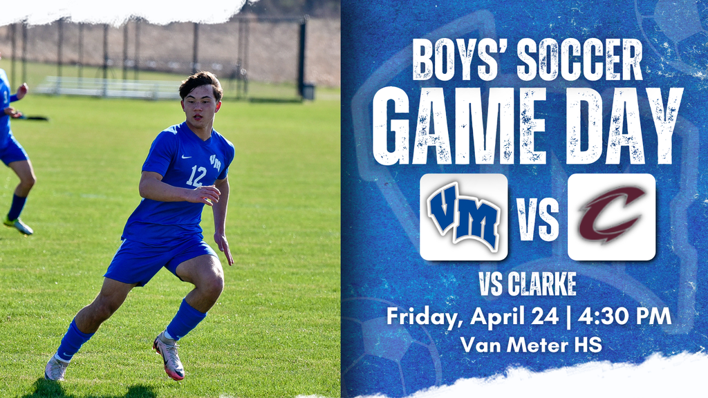 Boy in blue soccer uniform running on grass field during a game at Van Meter High School.
