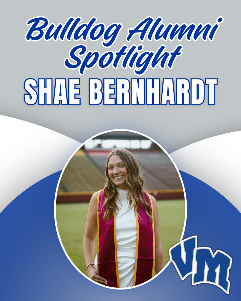 Portrait of Shae Bernhardt in graduation attire on a football field for Bulldog Alumni Spotlight.