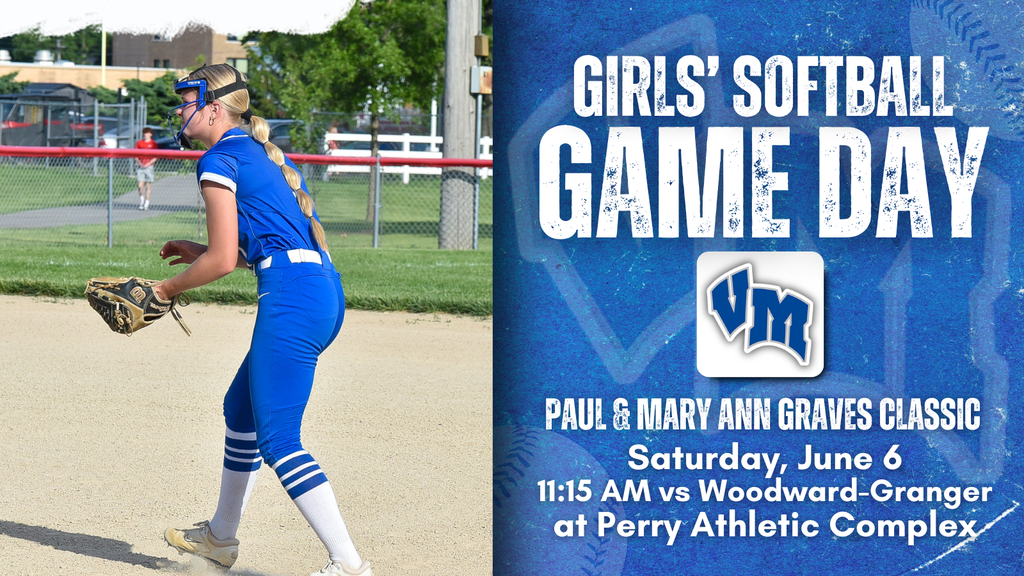 Female softball player in blue uniform ready to catch a ball on a sunny field during a game day event.