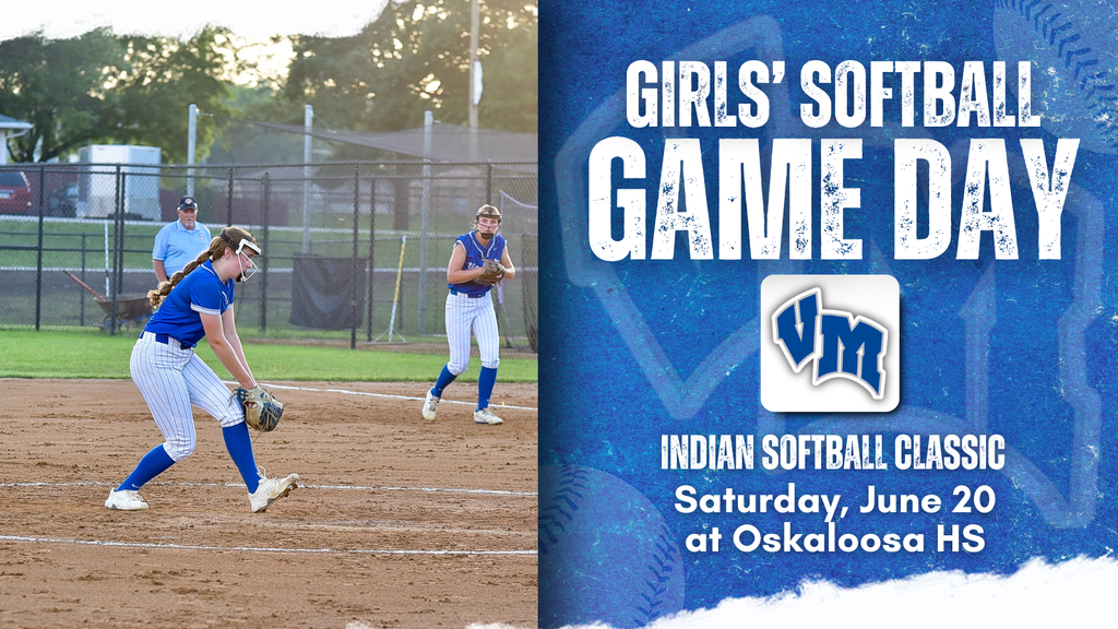 Female softball player in blue and white uniform pitching during a game at a sunny outdoor field.