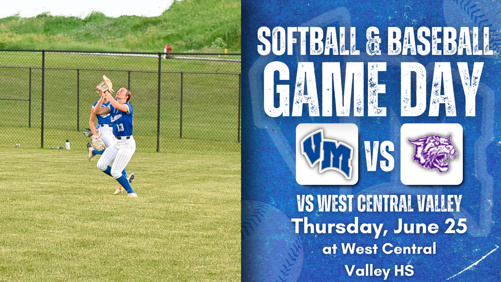 Two softball players in blue uniforms catching a ball on a grassy field during a game day event.