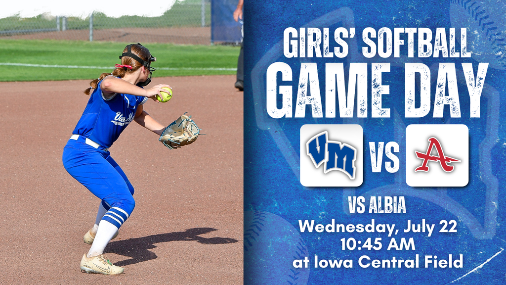 Female softball player in blue uniform preparing to pitch on a dirt field during game day announcement.