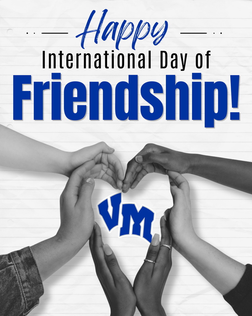 Hands of diverse friends forming a heart shape around blue VM letters, celebrating International Day of Friendship message above.