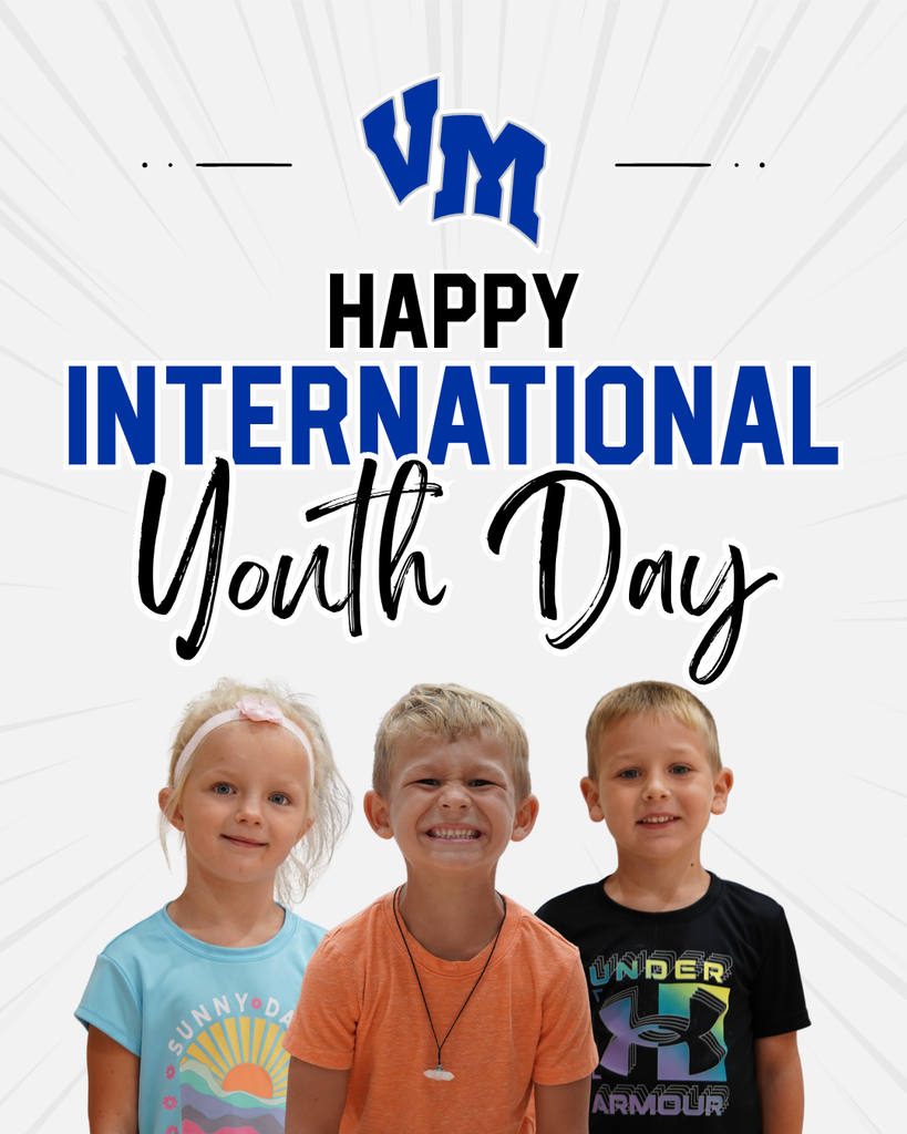 Three smiling children stand below a bold Happy International Youth Day message with a VM logo above on a light background.