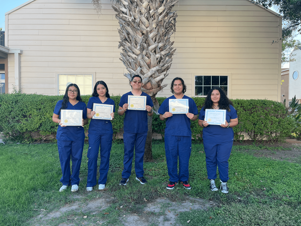 students holding certificates