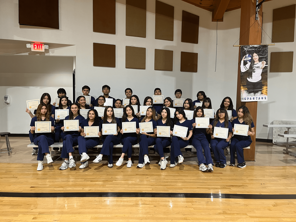 students holding certificates