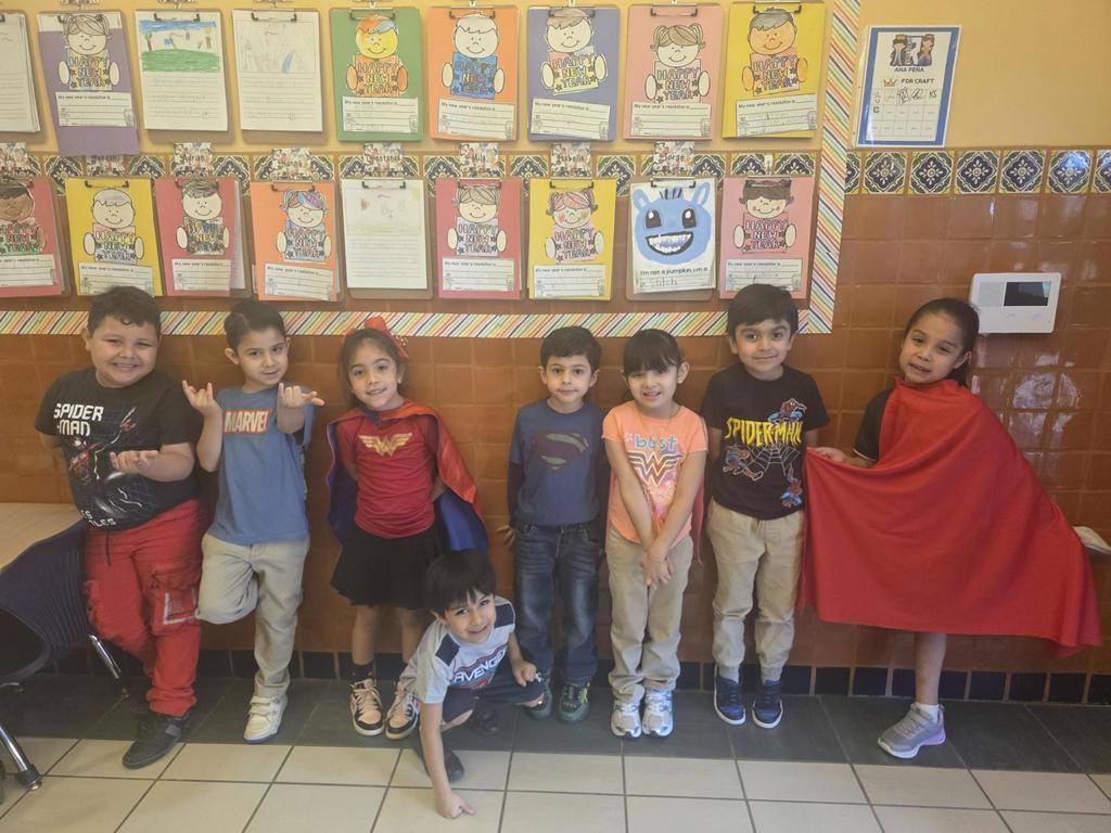 students in a line dressed in superhero suits