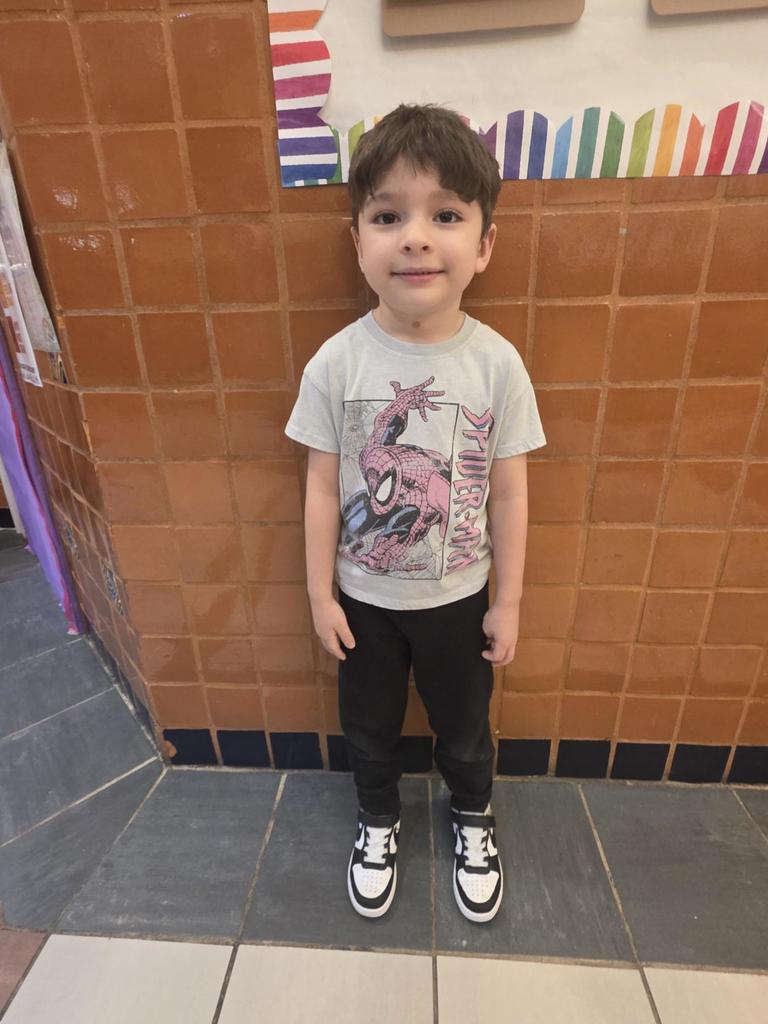 student in spiderman shirt