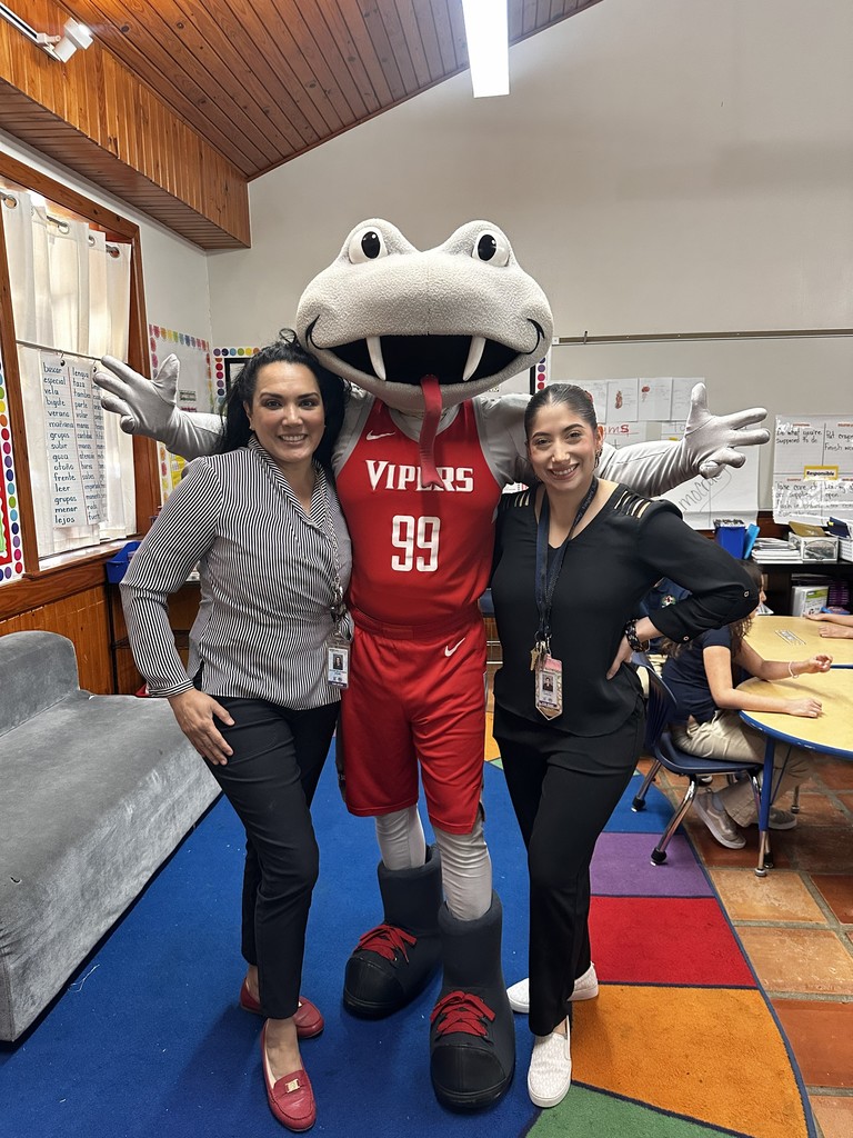Mrs. Cortez, Ms. De La Garza and Fang pose for a photo