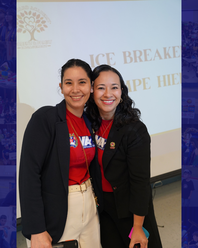 Two women smiling, standing next to each other in front of a banner with text.