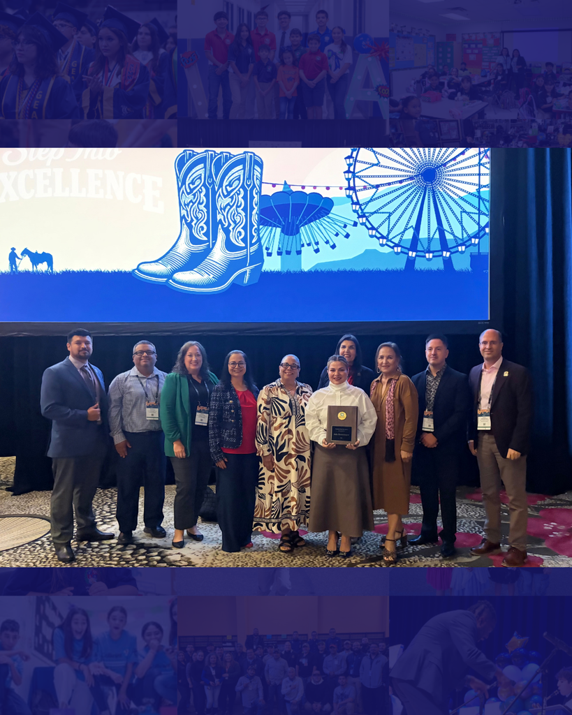 Group of people standing in front of a screen. One person holds a plaque. The screen shows boots and a Ferris wheel.