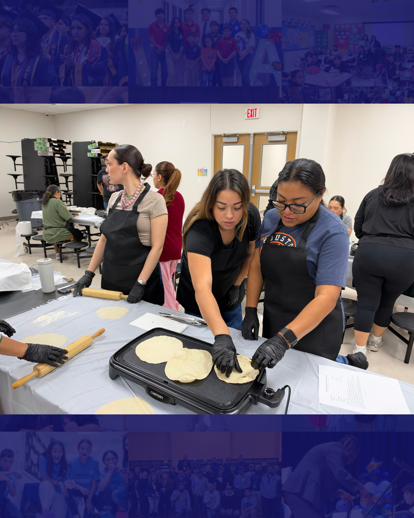 Two women wearing aprons and gloves cook tortillas on a griddle in a classroom. Other women work at tables behind them.