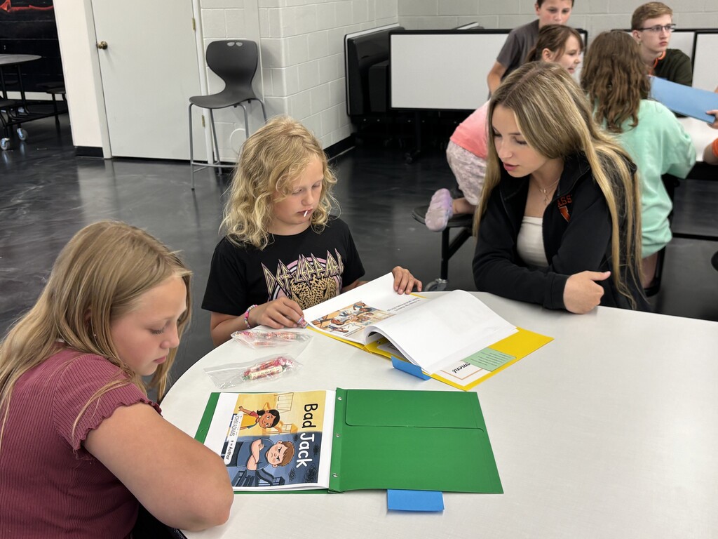 Freshmen and their reading buddies from 2nd and 3rd grades
