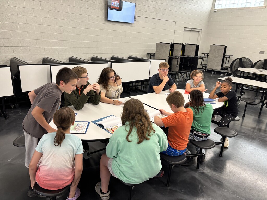 Freshmen and their reading buddies from 2nd and 3rd grades