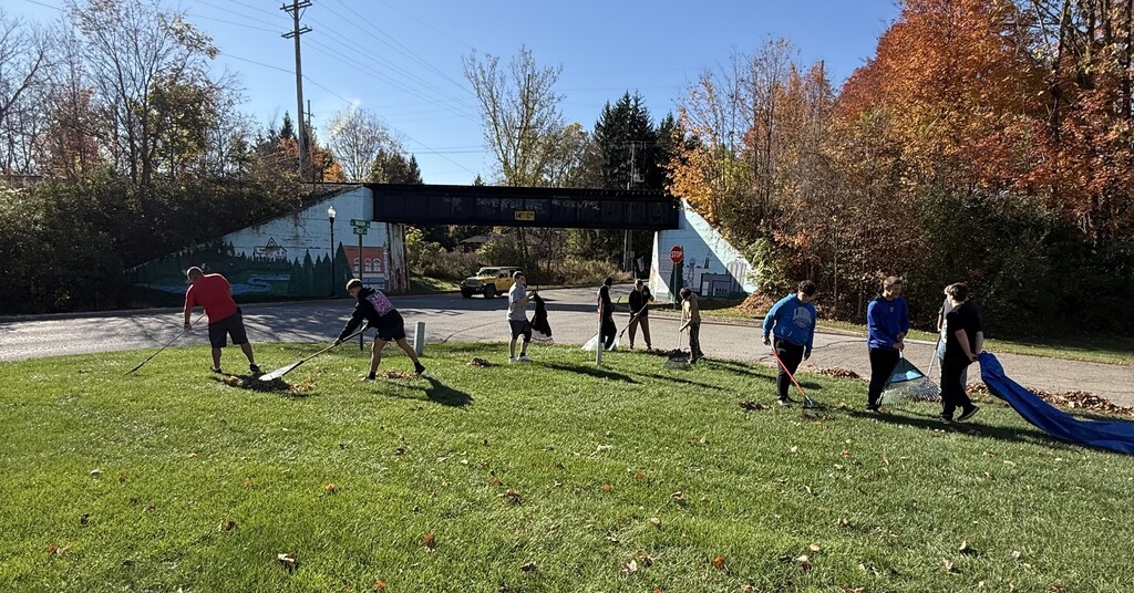 Football team raking at the Historical Society Museum