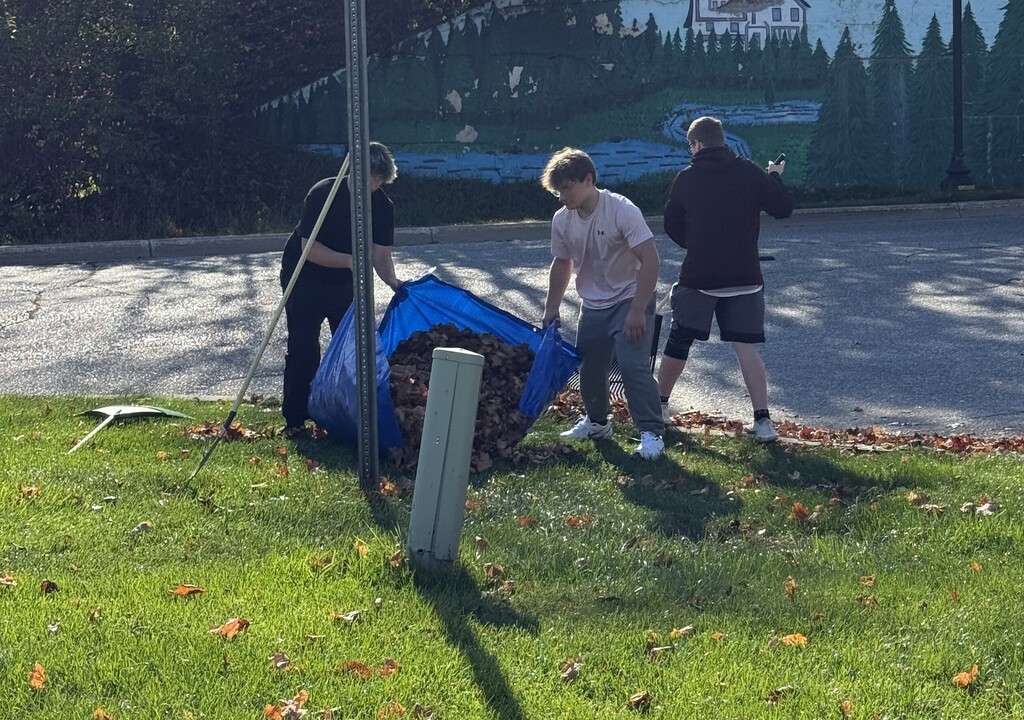 Football team raking at the Historical Society Museum