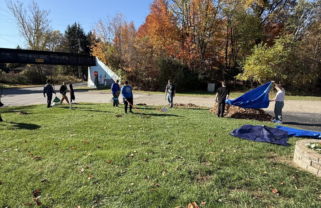 Football team raking at the Historical Society Museum