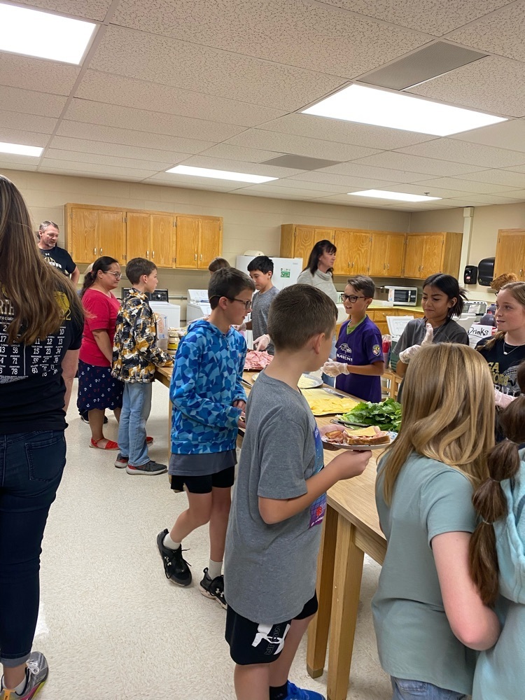 Students serving sandwiches