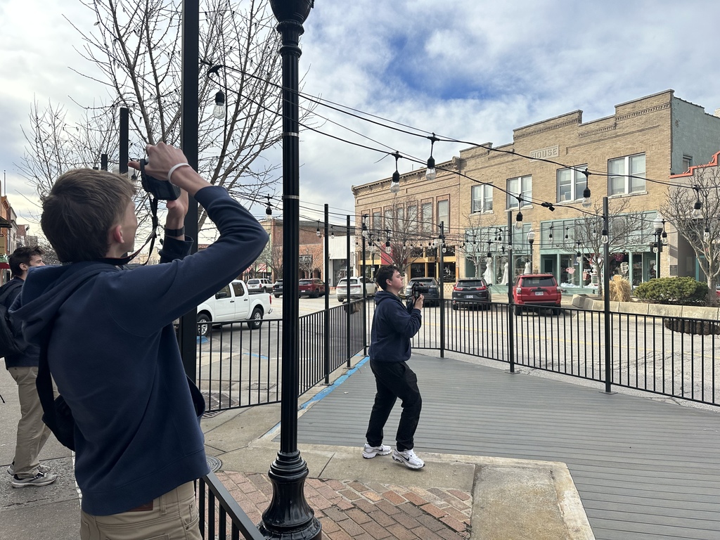 Photography students taking pictures downtown