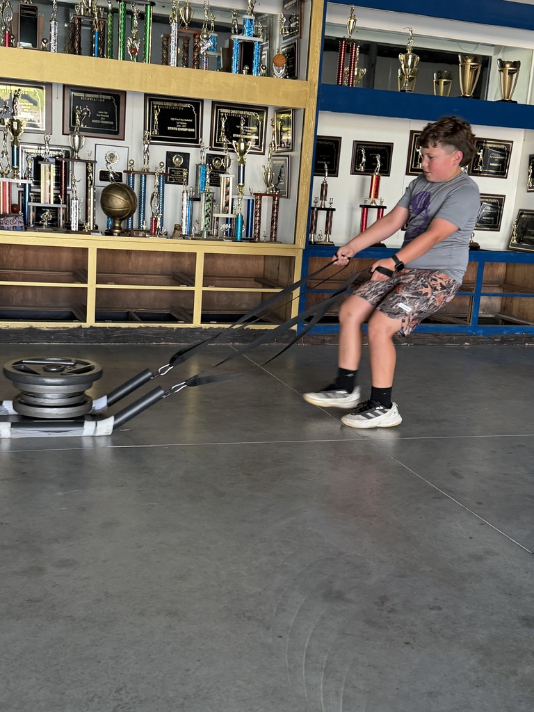 Student pulling weights