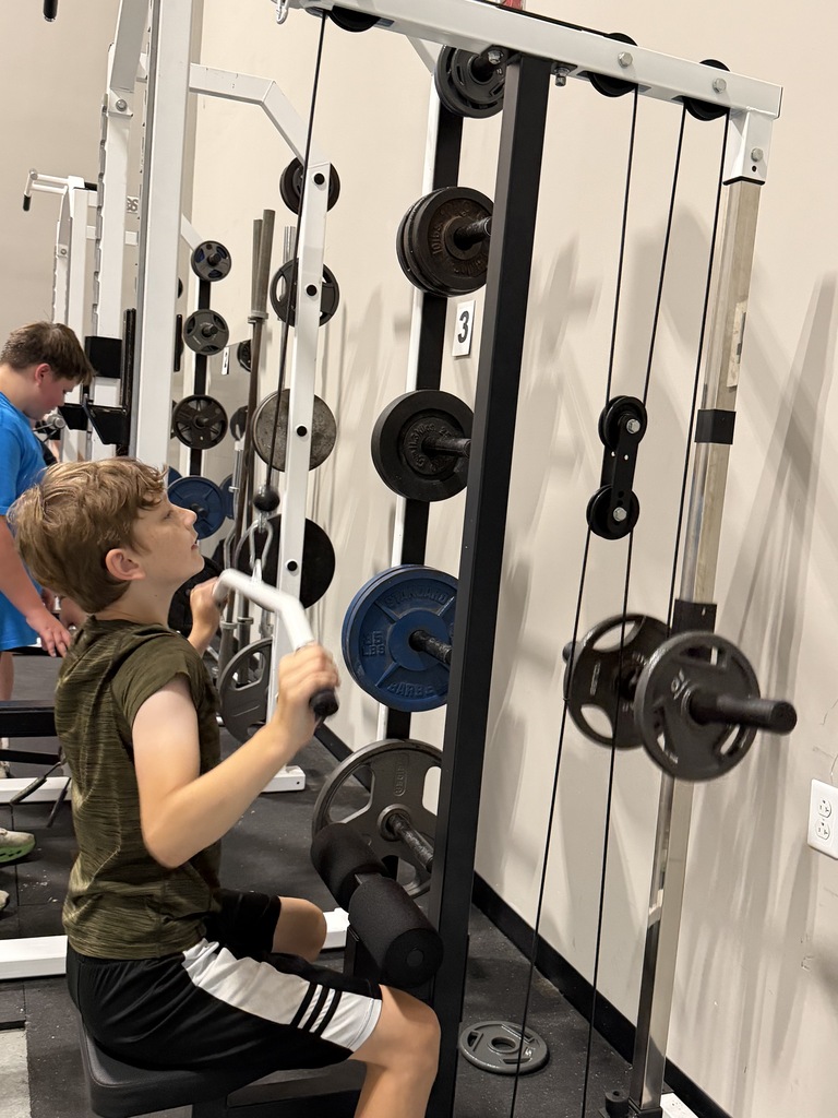 Student on weight machine
