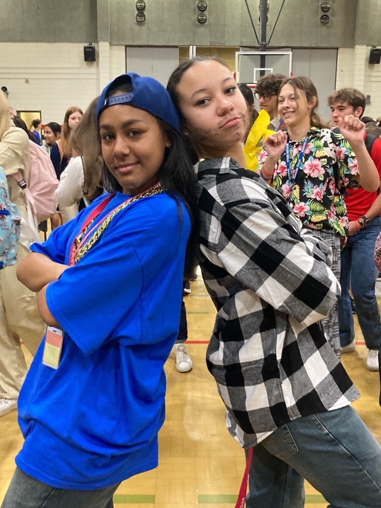 Sophomore girls dress as characters from the movie Friday. 