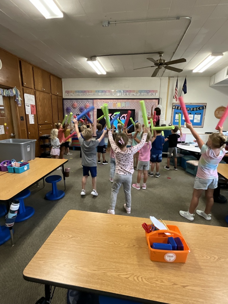 Kindergarten  doing a fun activity with shapes