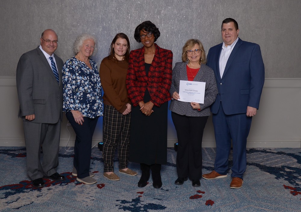 Board of education members with state education commissioner