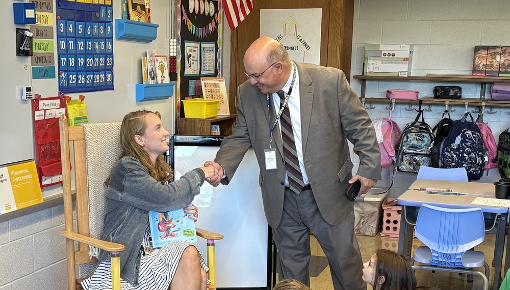 Dr Macary greets new teacher
