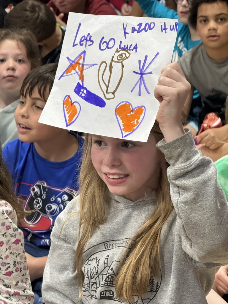 Supportive classmate with a poster! 
