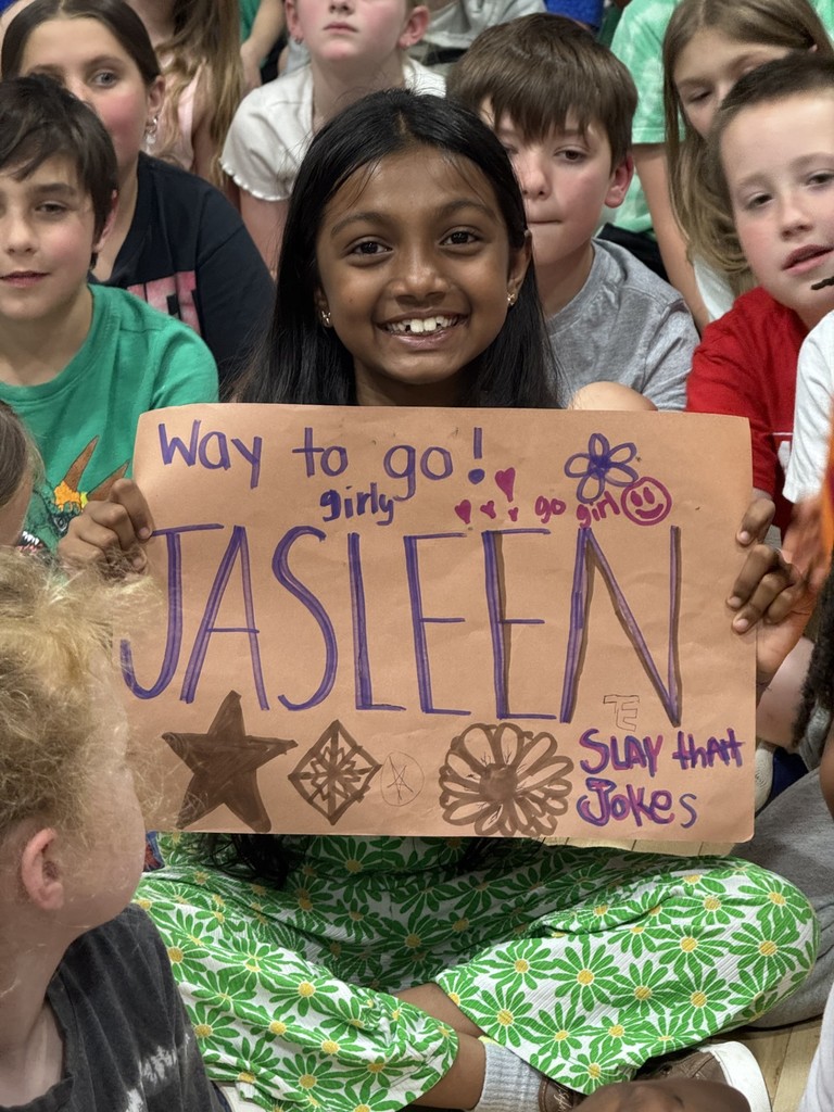 Supportive classmate with a poster! 