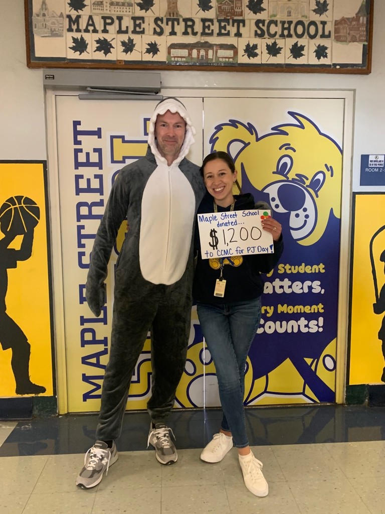 Mr. Egan and Mrs. Campitelli showing we raised $1200 for CCMC on PJ Day