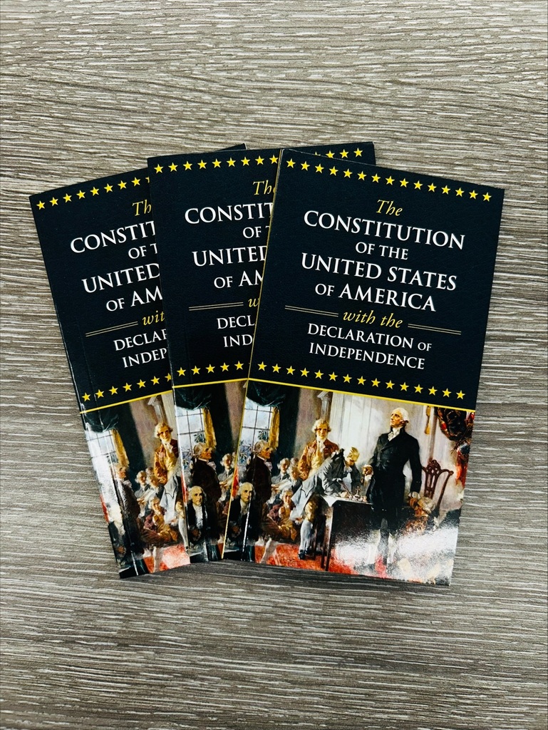 Constitution of the United States booklet, fanned out on desk