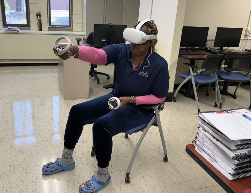 Tyresa Brown of Vernon uses a virtual reality program to gain CNA experience