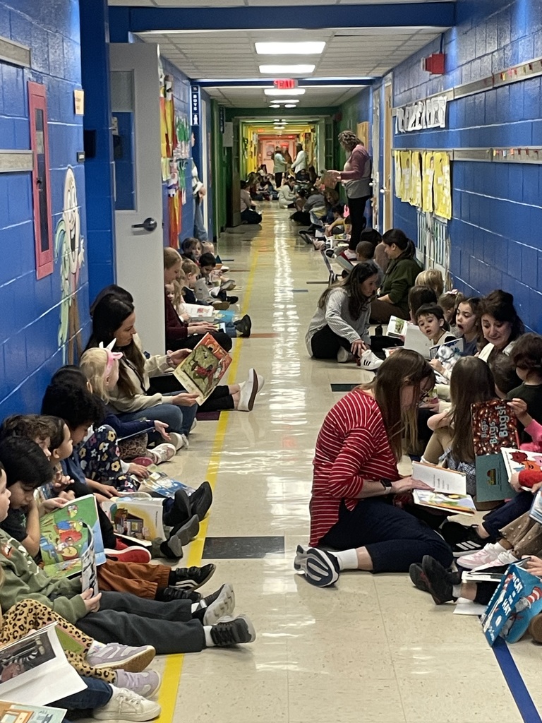 Students reading in the hallway