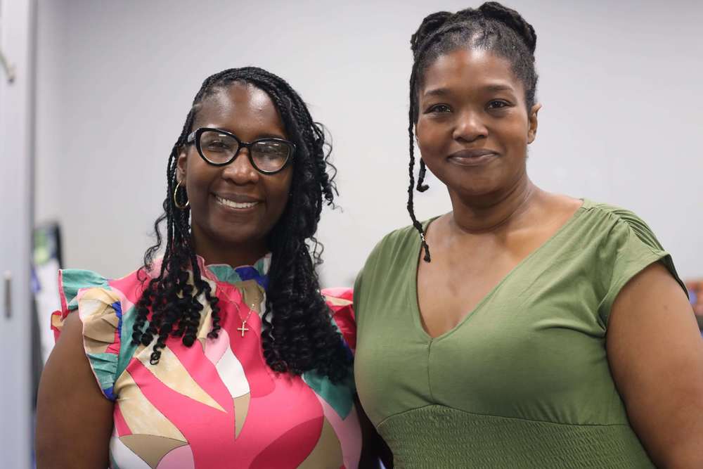 2 Women smiling for a photo