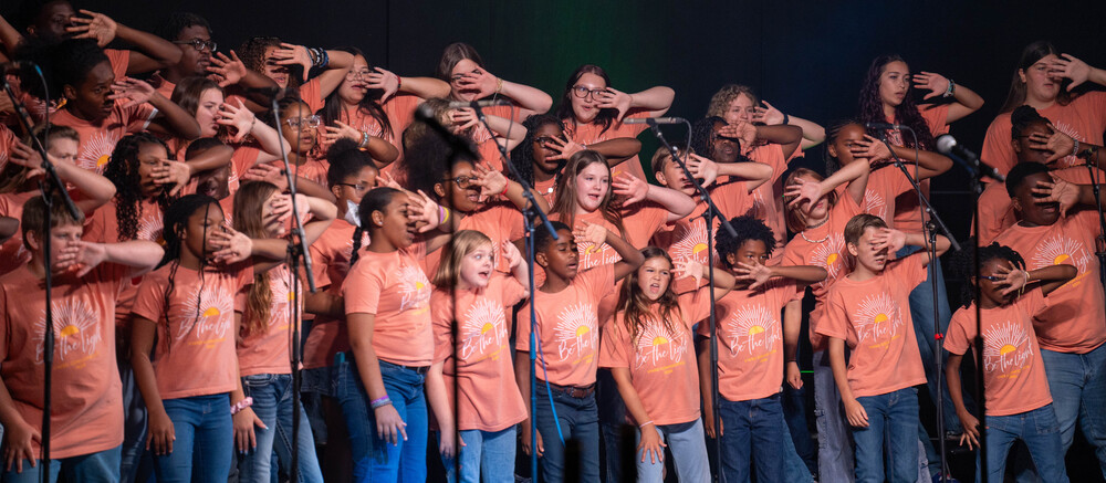 students with expressions during song