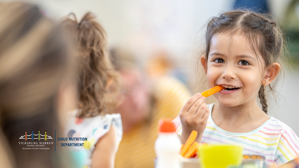 child eating a carrot