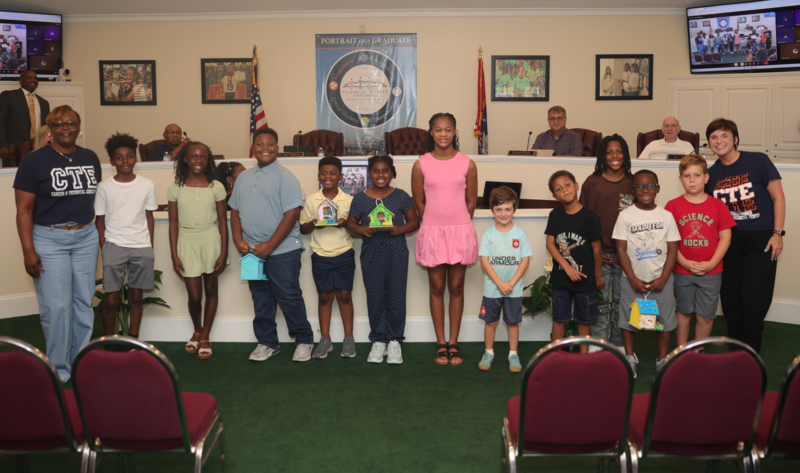 group photo of student campers and district leaders