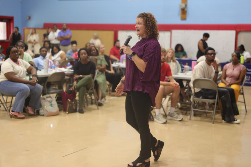 principal speaking at the mic