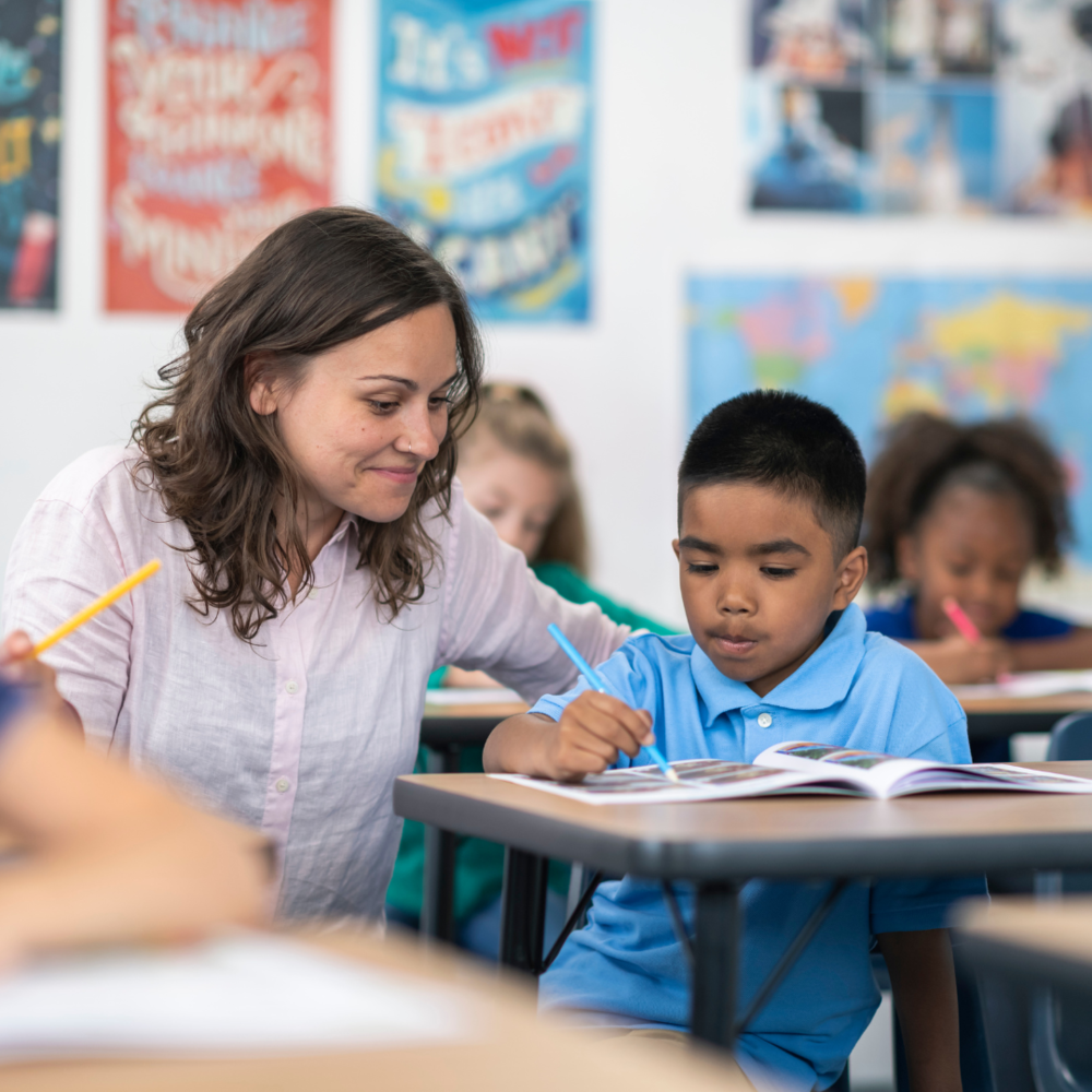 VISD Lead Teacher with a student in a classroom